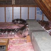 #7 Attic After - Installation on new rolled batten faced insulation and installation of new heating and air conditioning duct supply lines.